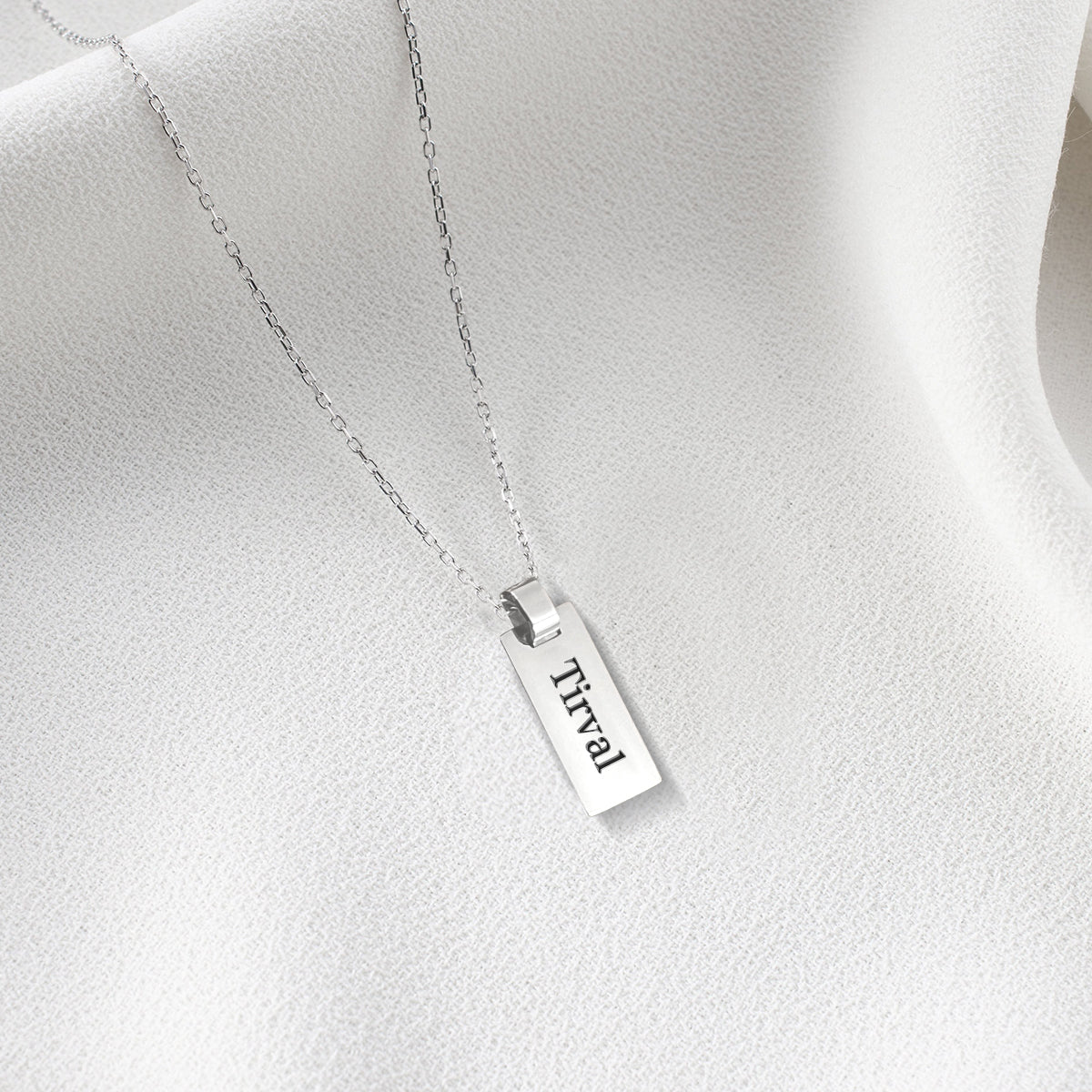 A beautiful custom stainless steel child necklace featuring a personalized pendant and adjustable chain, perfect for kids.