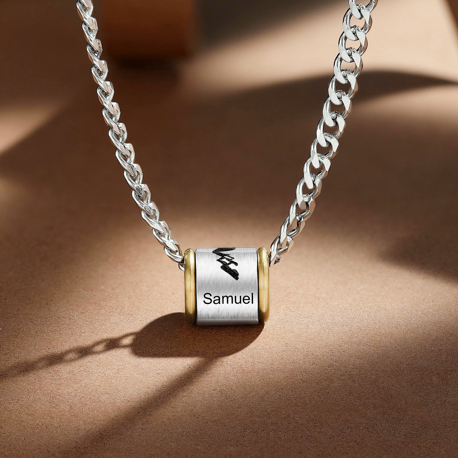 A stylish custom stainless steel necklace with a personalized pendant, showcasing its sleek design and 60cm chain length.