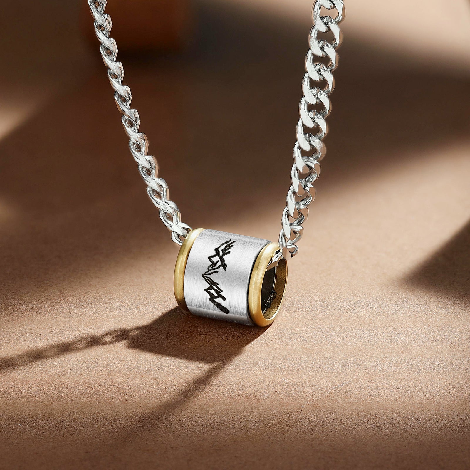 A stylish custom stainless steel necklace with a personalized pendant, showcasing its sleek design and 60cm chain length.