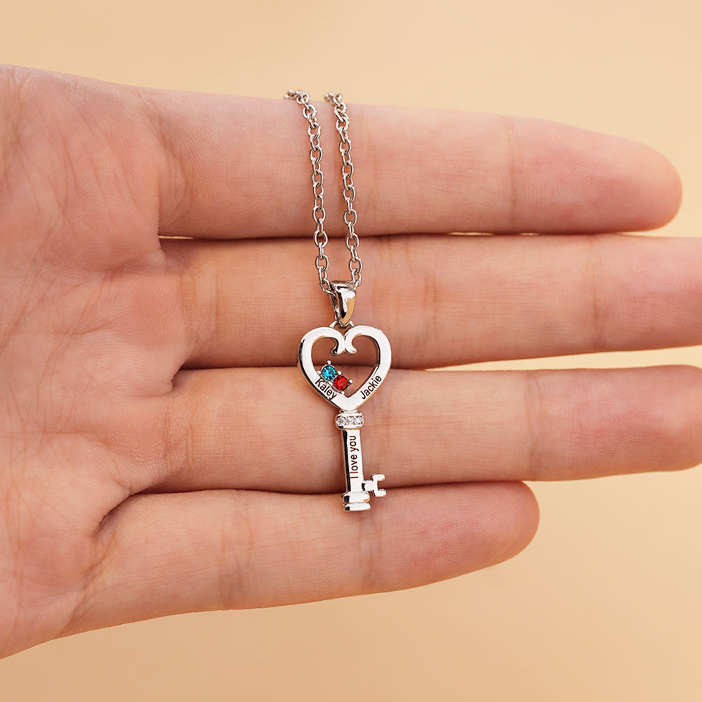 Customized Name Key Necklace made of stainless steel, featuring a personalized name pendant, tarnish-resistant and hypoallergenic, elegantly displayed in a gift pouch.