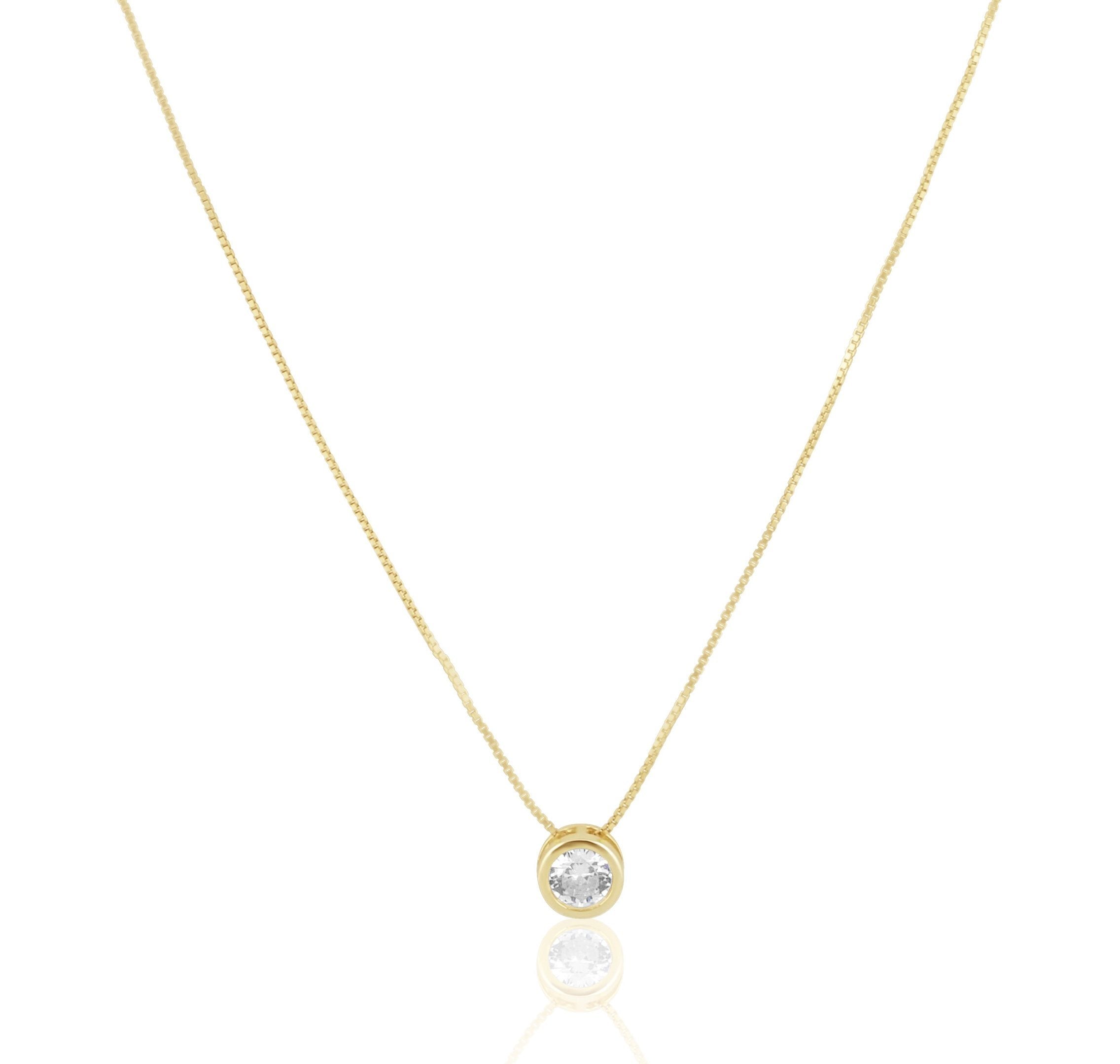 A beautiful CZ Bezel Necklace featuring a 4mm round cubic zirconia stone on a 16-inch box chain, available in silver and gold.