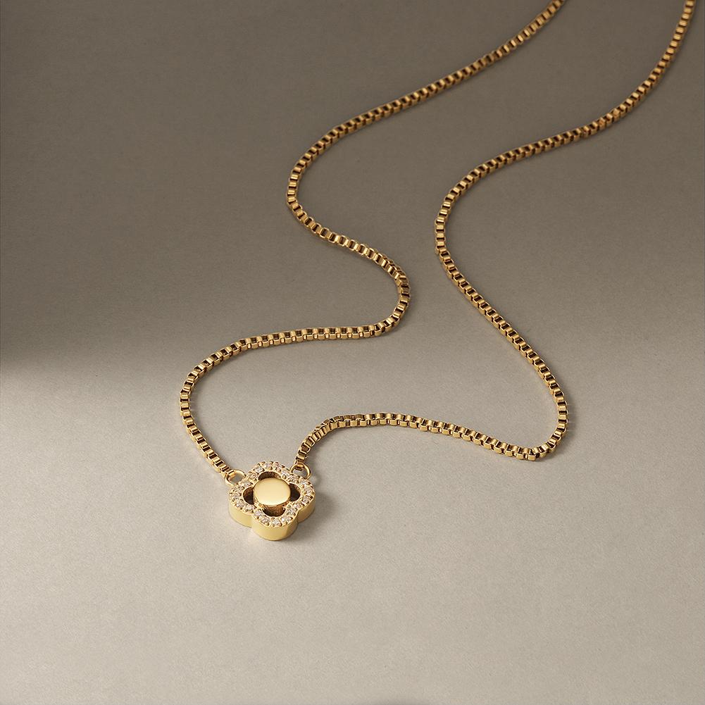 CZ Clover Necklace made of surgical stainless steel with 14K gold plating, featuring a charming clover design adorned with cubic zirconia.