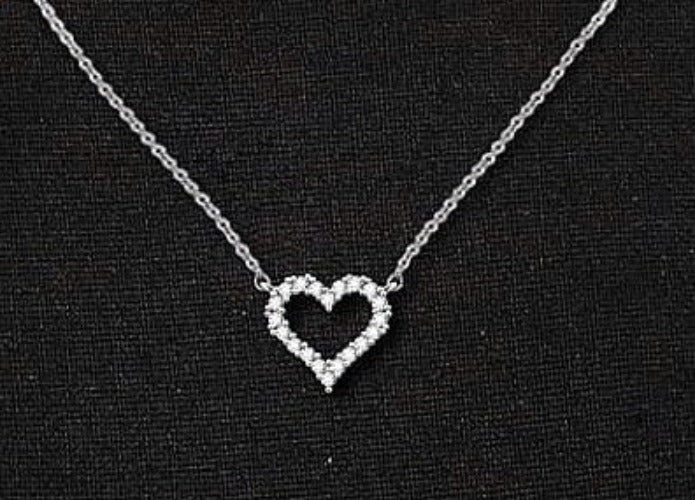 CZ Heart Necklace featuring a hollow heart pendant on an 18-inch silver clavical chain, elegantly crafted from stainless steel.