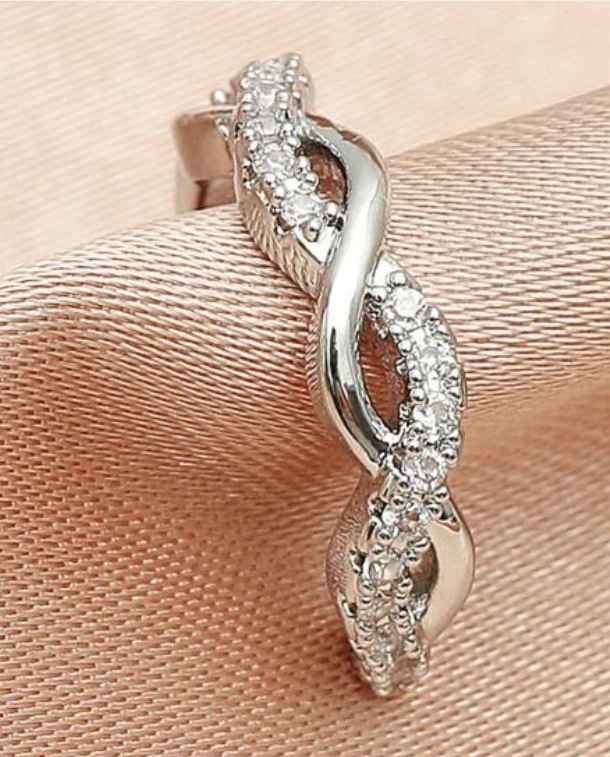 CZ Twist Ear Cuff featuring a silvertone finish and sparkling cubic zirconia stones, designed for a stylish upper ear fit.