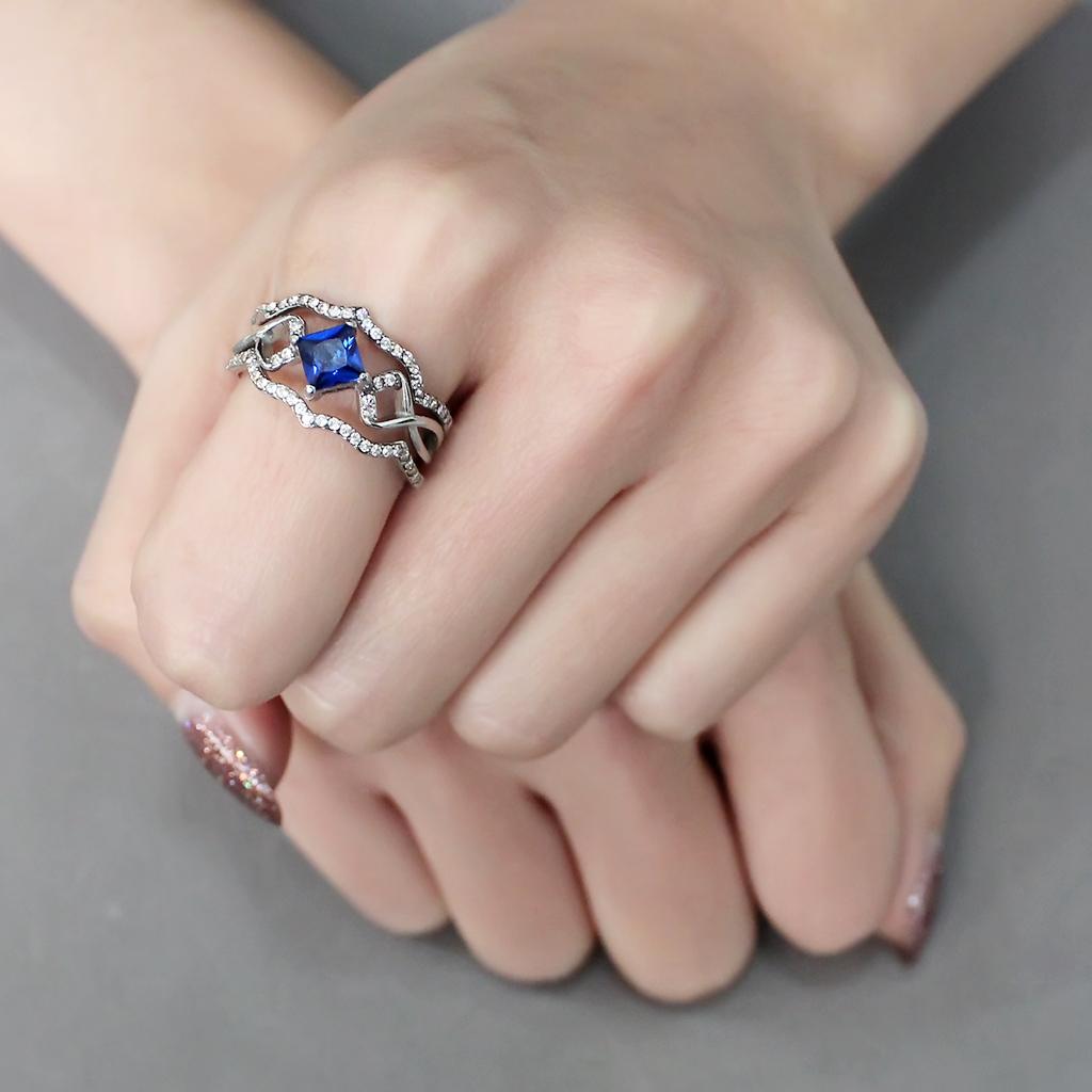 DA272 High Polished Stainless Steel Ring featuring a London Blue Spinel center stone, showcasing a sleek and modern design.