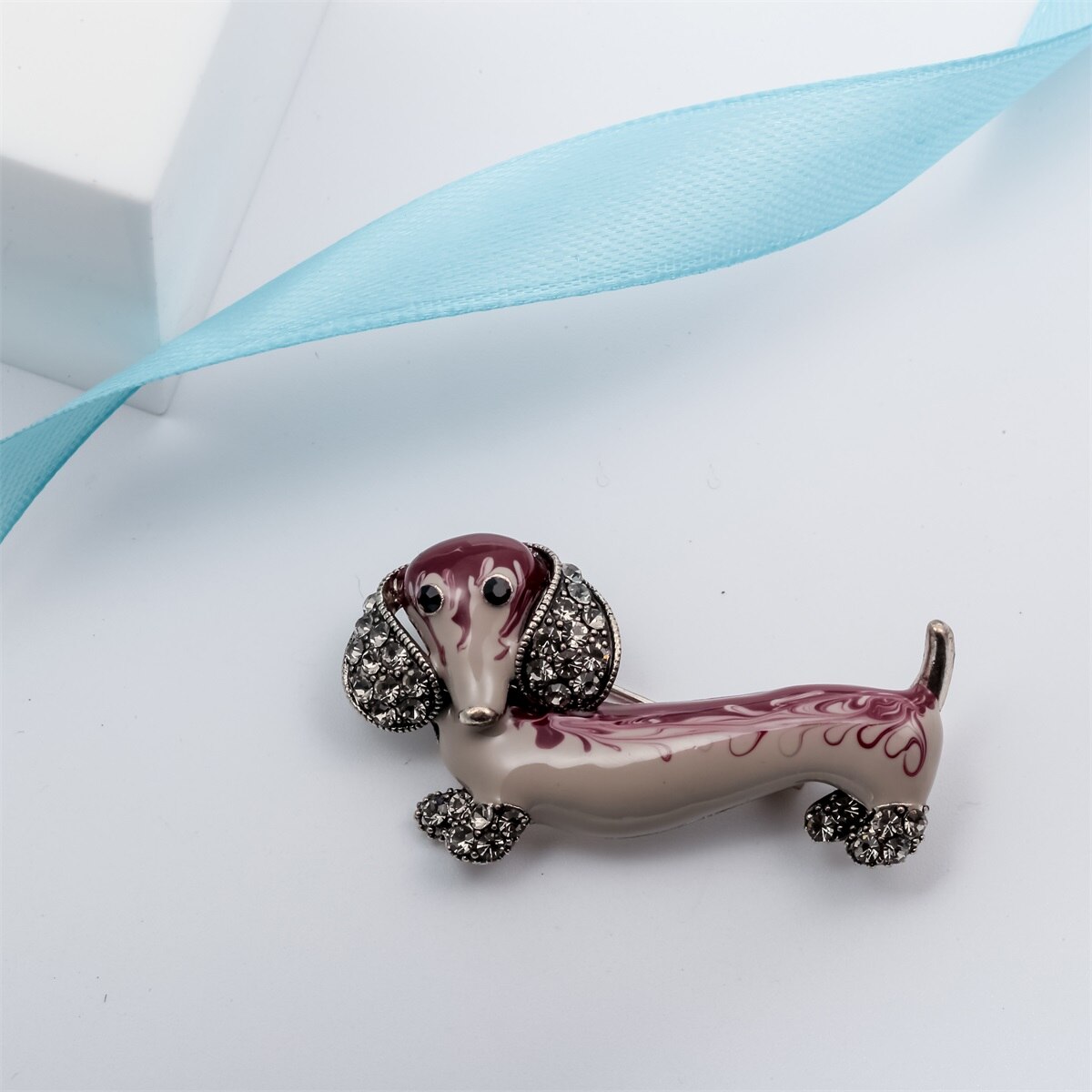 Dachshund Dog Brooch Pin featuring crystal and enamel in gold and silver colors, designed for women.