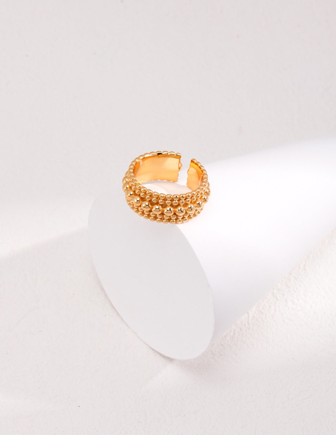 A delicate Dainty Beaded Band Ring made of sterling silver with gold vermeil, showcasing its intricate beaded design.