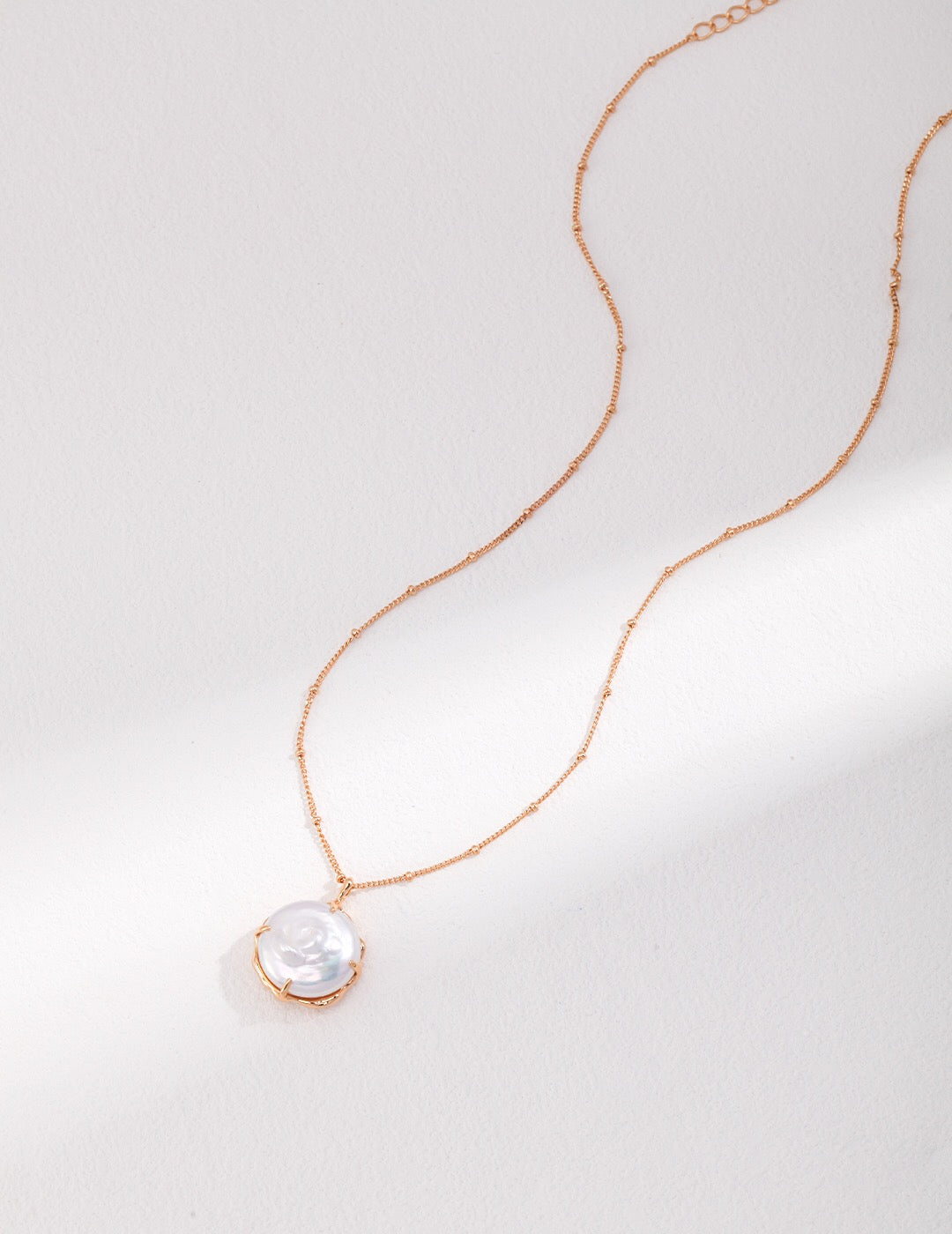 Dainty Big Round Pearl Pendant Necklace featuring a natural pearl and gold vermeil chain, elegantly displayed on a soft background.