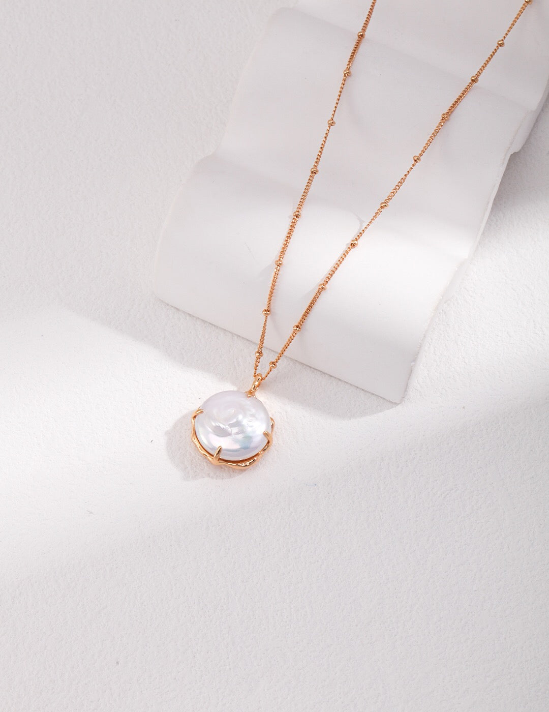 Dainty Big Round Pearl Pendant Necklace featuring a natural pearl and gold vermeil chain, elegantly displayed on a soft background.