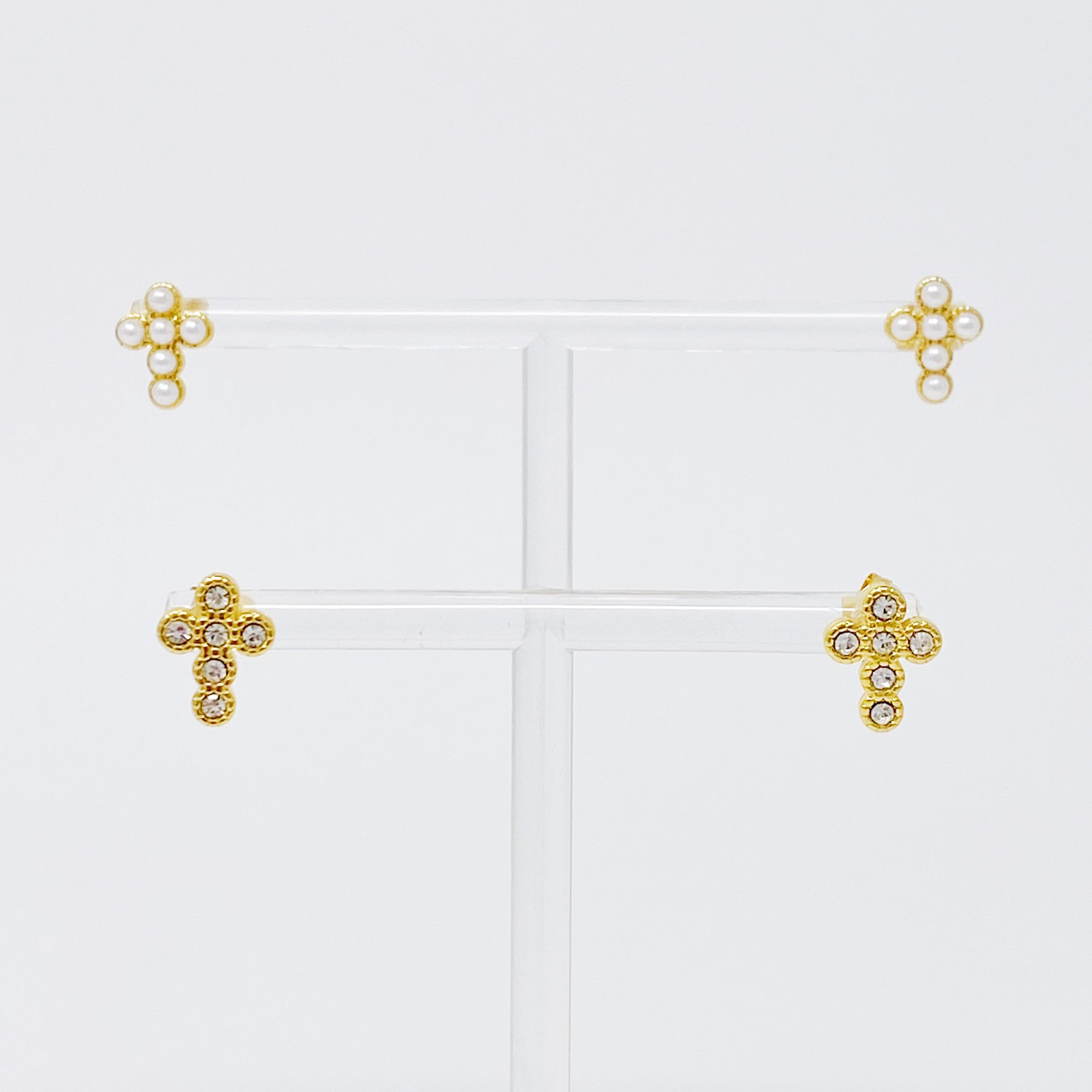 Dainty Cross Stud Earrings featuring sparkly cubic zirconia and pearl beads on a gold plated stainless steel base.