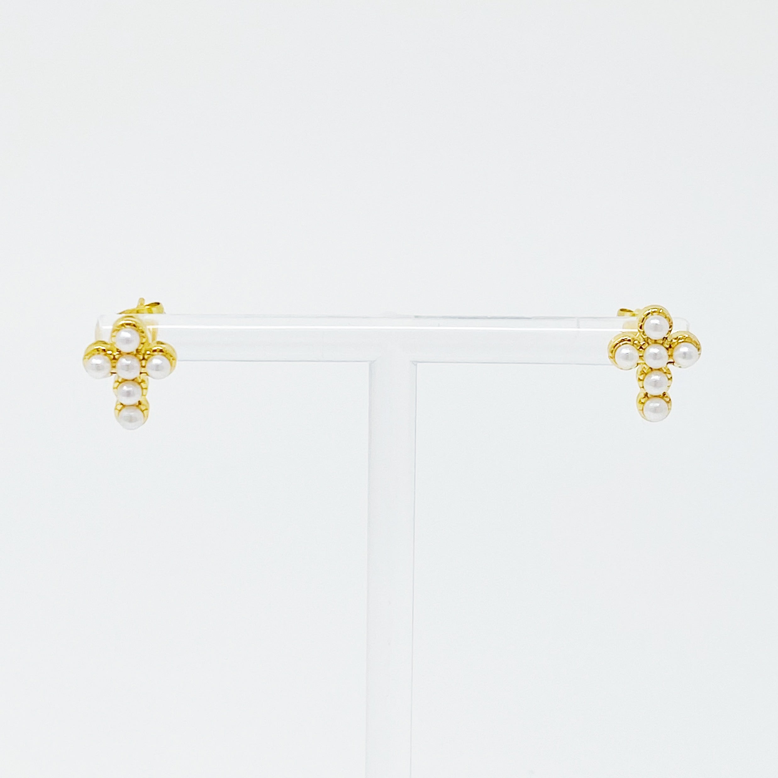 Dainty Cross Stud Earrings featuring sparkly cubic zirconia and pearl beads on a gold plated stainless steel base.