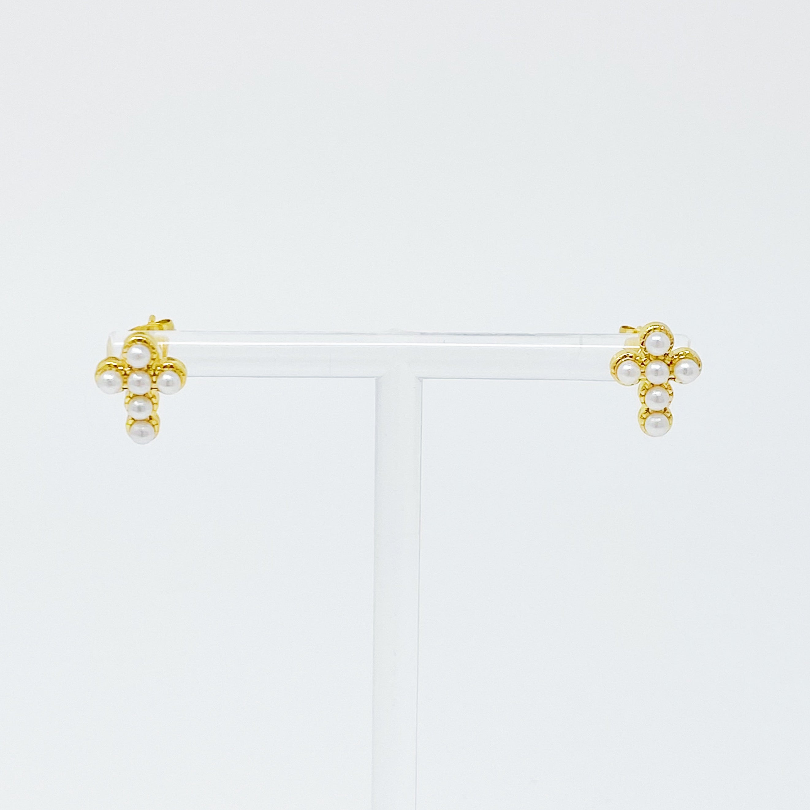 Dainty Cross Stud Earrings featuring sparkly cubic zirconia and pearl beads on a gold plated stainless steel base.