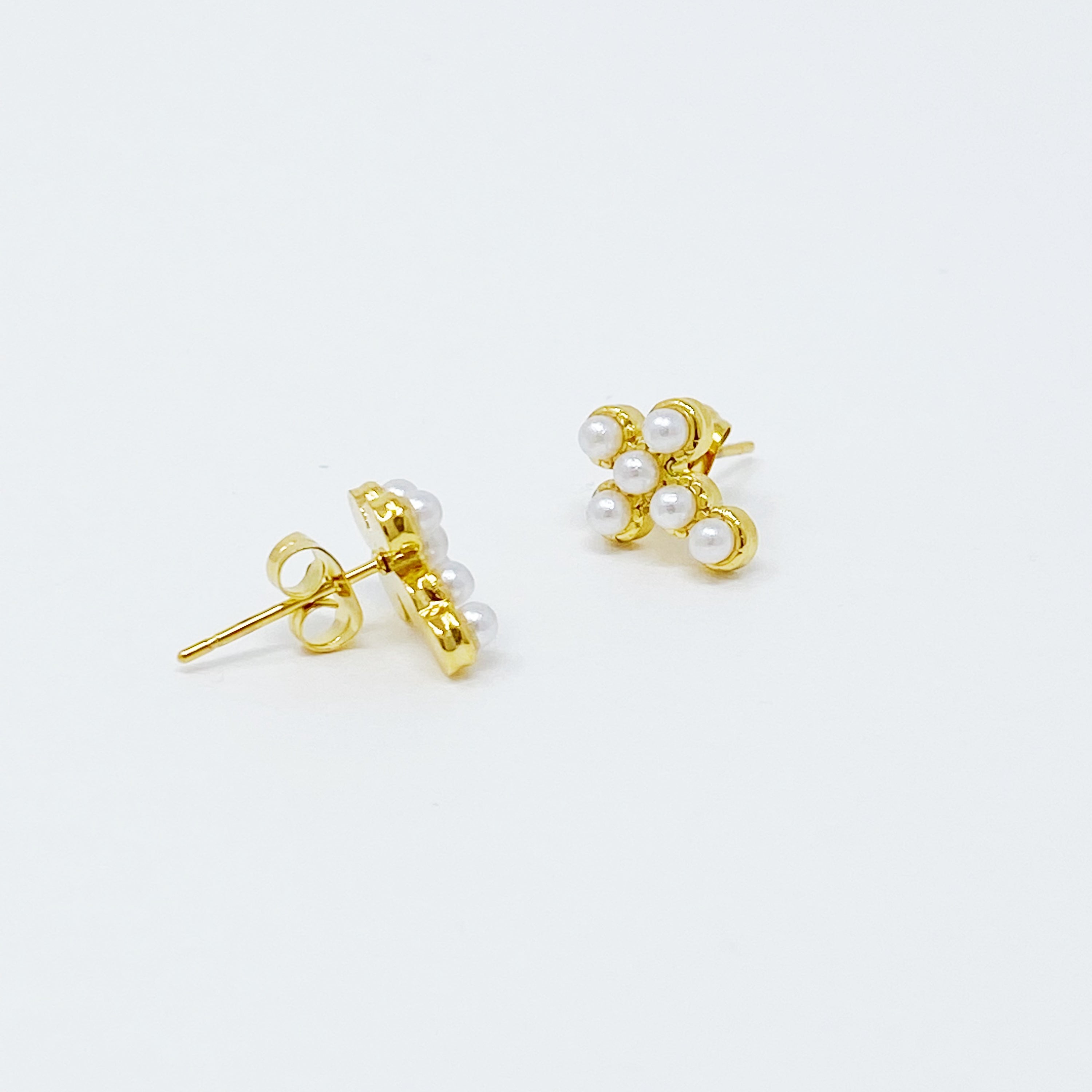 Dainty Cross Stud Earrings featuring sparkly cubic zirconia and pearl beads on a gold plated stainless steel base.