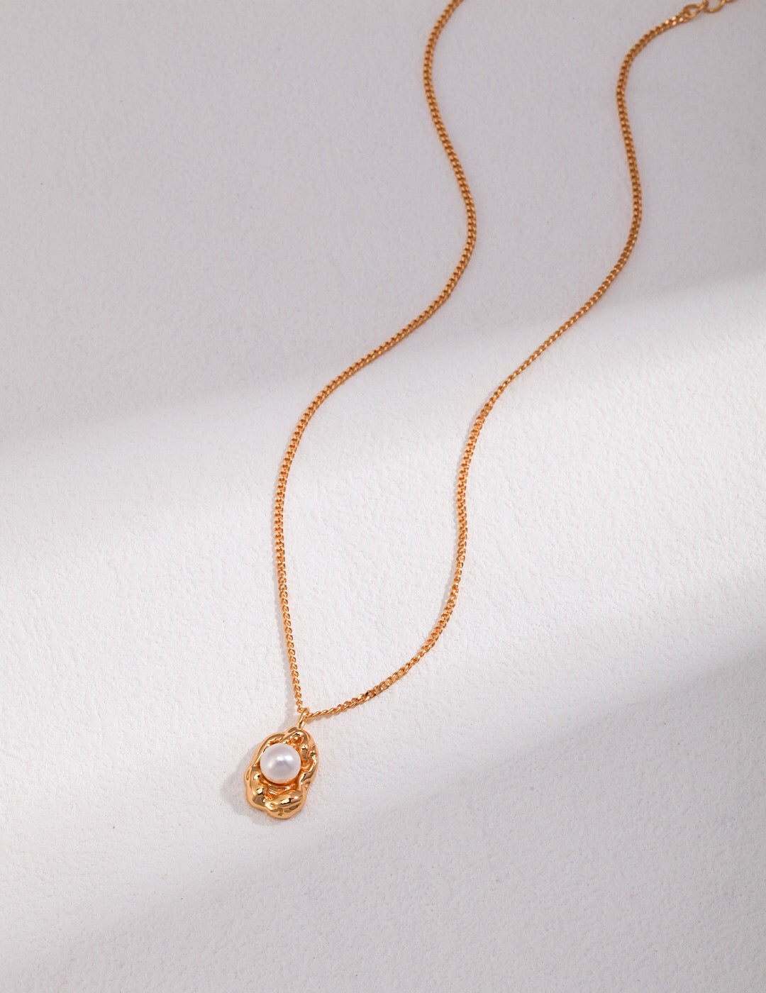 Dainty Freshwater Pearl Pendant Necklace featuring natural pearls and gold vermeil on sterling silver, elegantly displayed on a soft background.