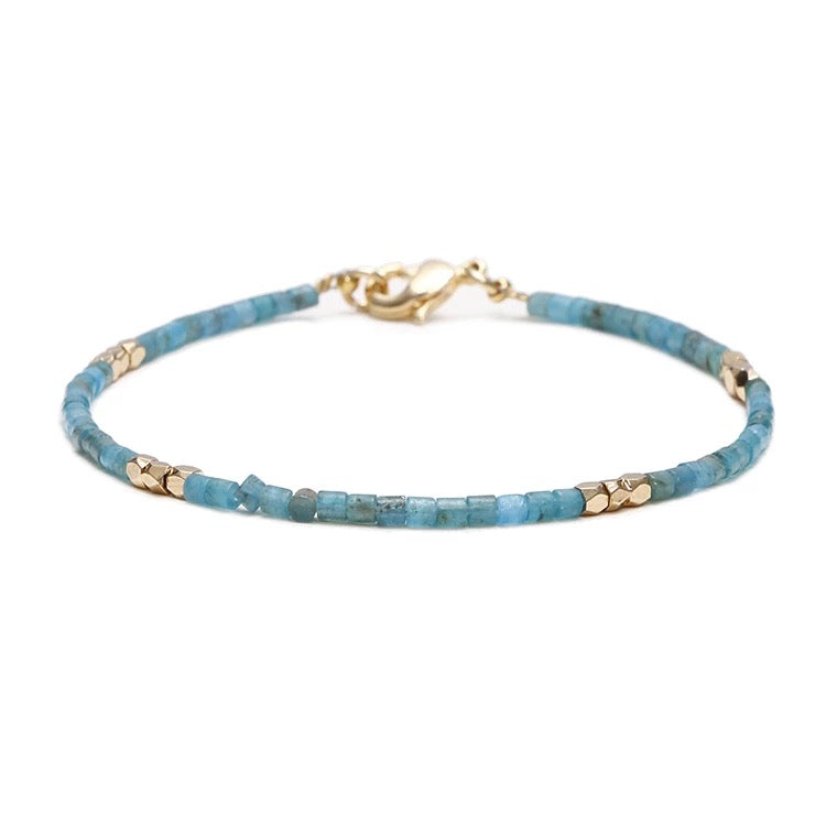 Dainty Gemstone Tube Bead Bracelet featuring tiny natural gemstone beads in various colors, adjustable size for comfort.