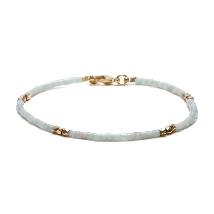 Dainty Gemstone Tube Bead Bracelet featuring tiny natural gemstone beads in various colors, adjustable size for comfort.