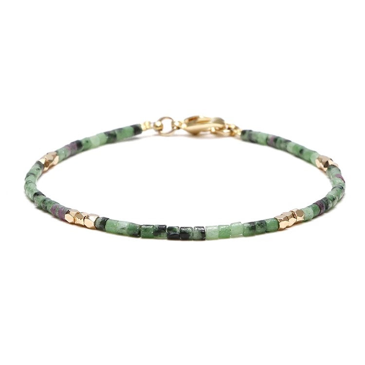 Dainty Gemstone Tube Bead Bracelet featuring tiny natural gemstone beads in various colors, adjustable size for comfort.