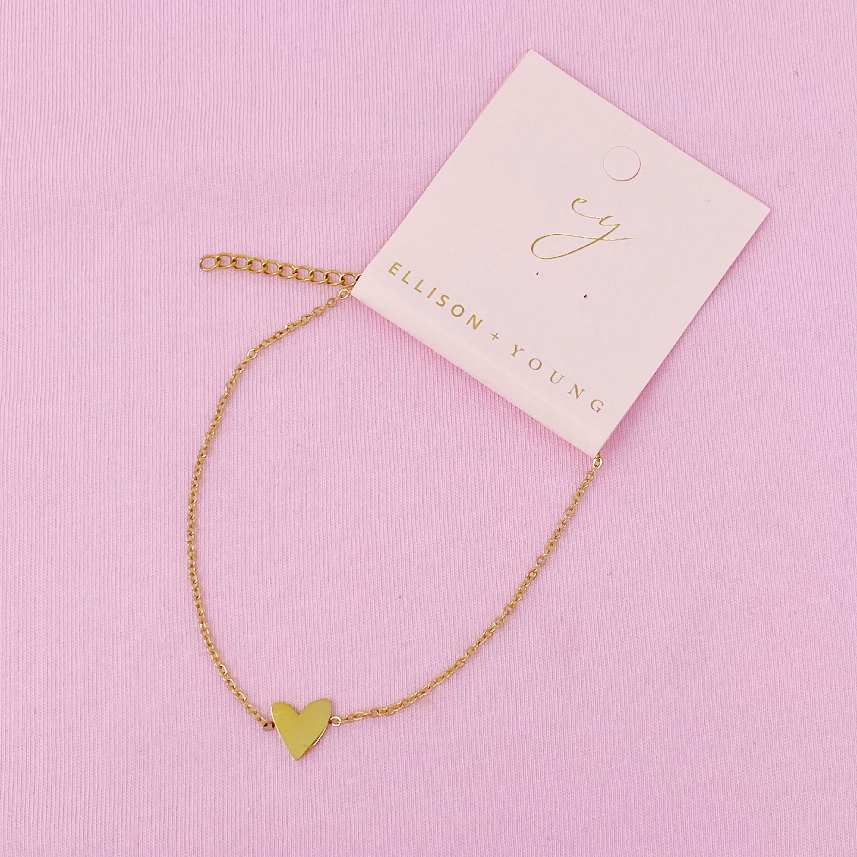 A delicate gold plated stainless steel anklet featuring a polished heart charm, perfect for stylish ankle adornment.