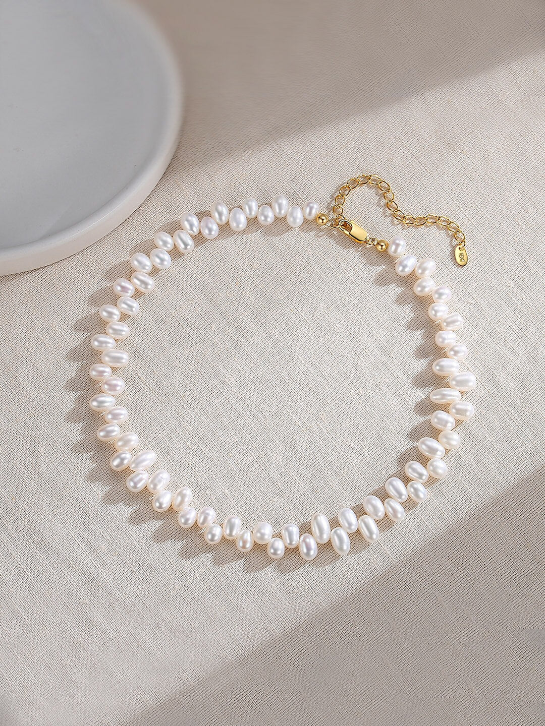 Dainty Pearl Beaded Choker Necklace featuring genuine freshwater pearls and gold vermeil chain, elegantly displayed on a soft background.