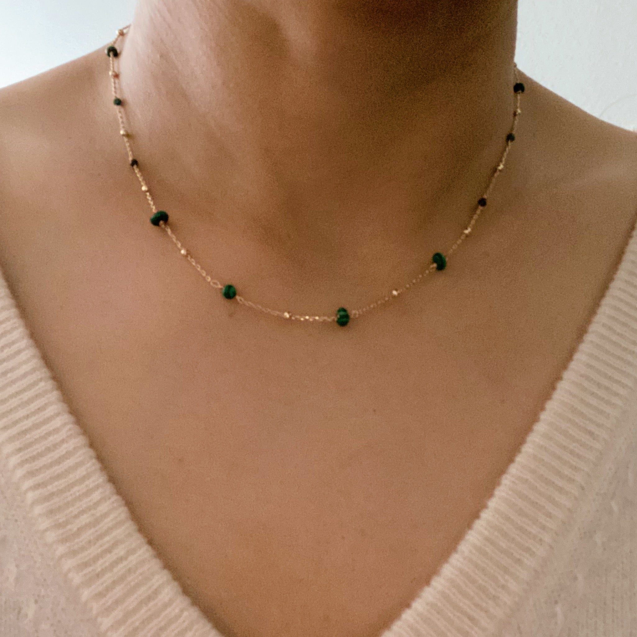 A delicate Dainty Precious Stone Bead Necklace featuring varying sizes of natural stone beads on a gold plated chain.