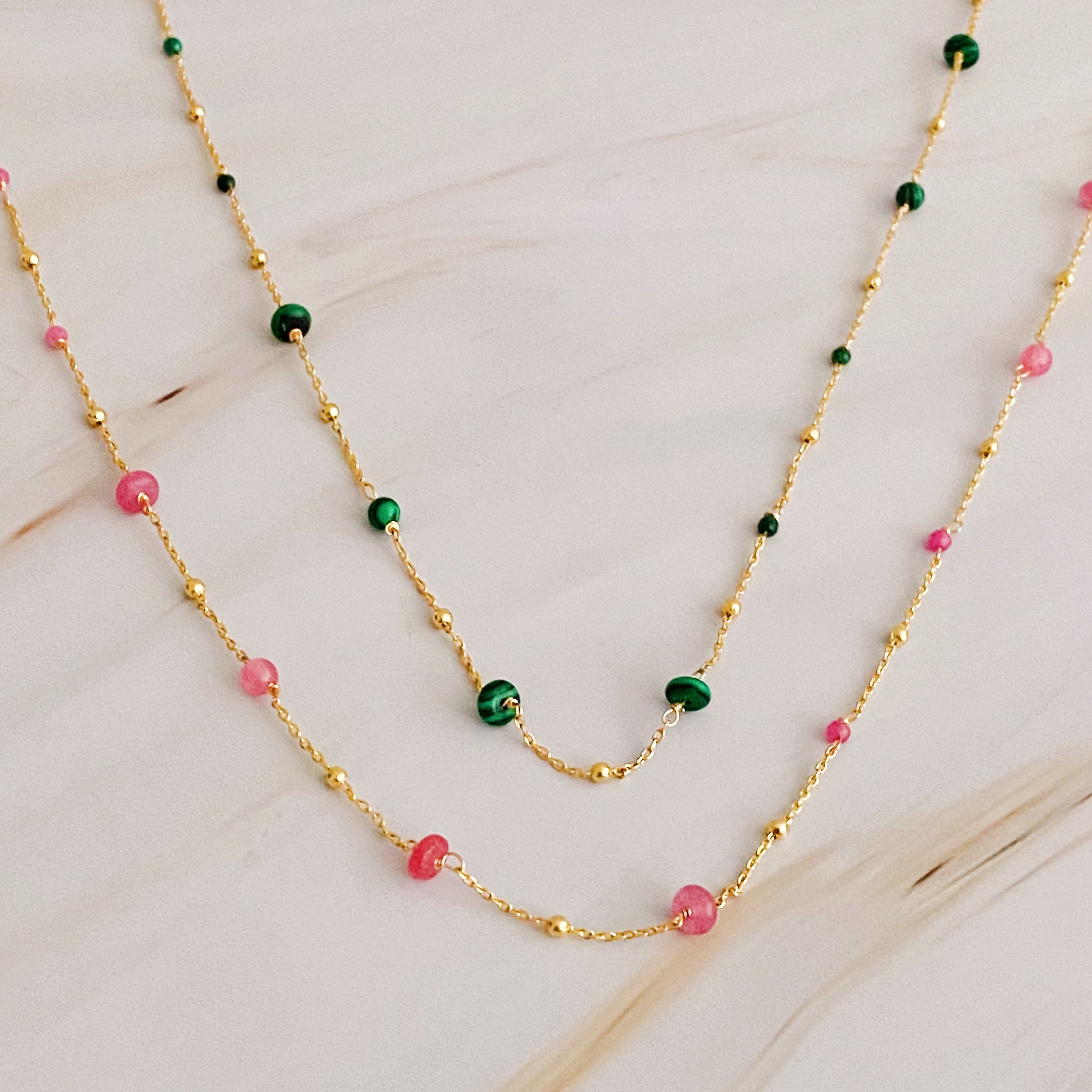 A delicate Dainty Precious Stone Bead Necklace featuring varying sizes of natural stone beads on a gold plated chain.