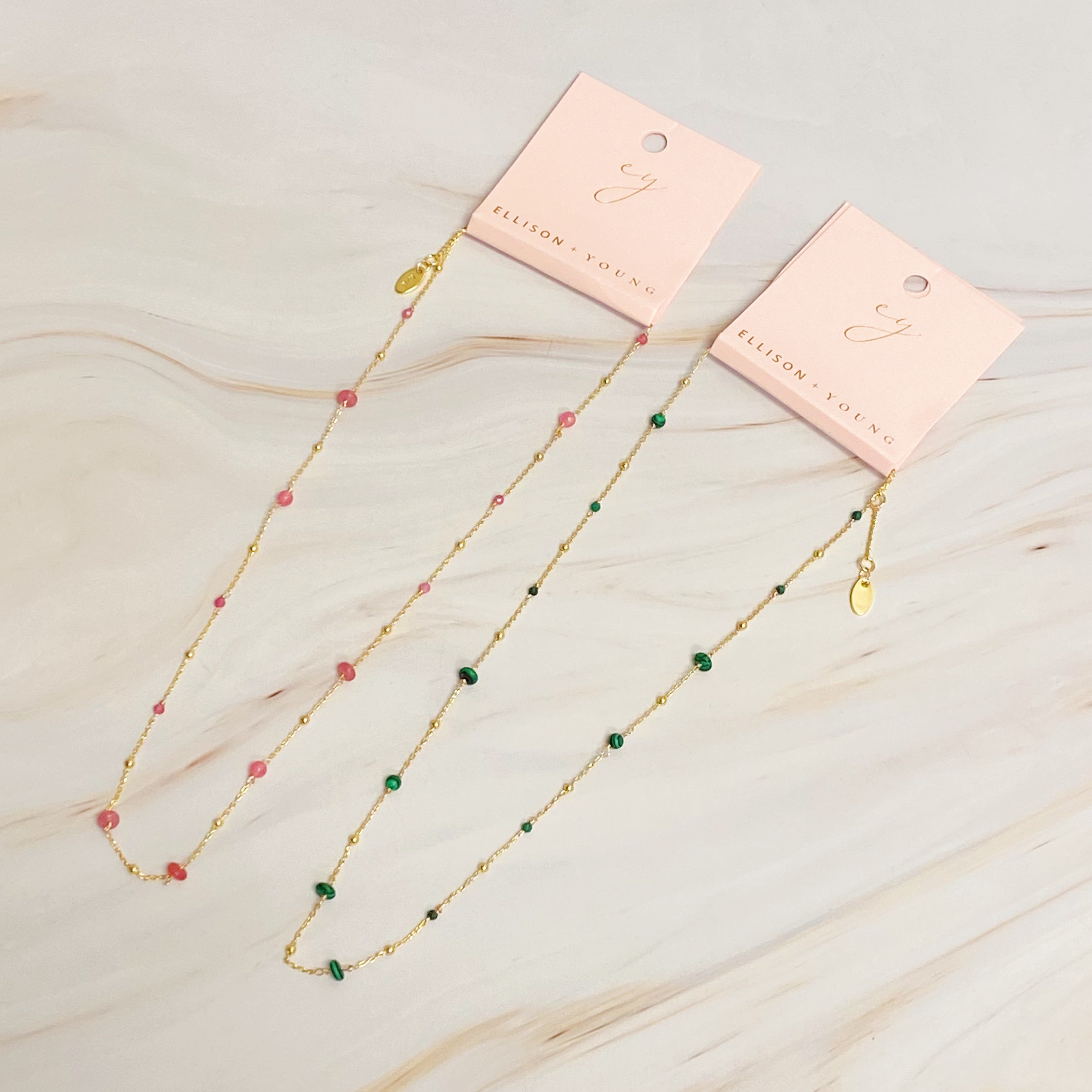 A delicate Dainty Precious Stone Bead Necklace featuring varying sizes of natural stone beads on a gold plated chain.