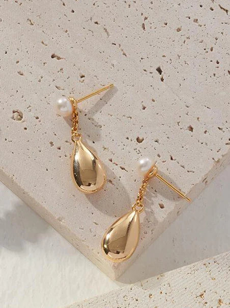 Dainty Raindrop Pearl Earrings featuring natural pearls and gold vermeil, elegantly designed for a sophisticated look.