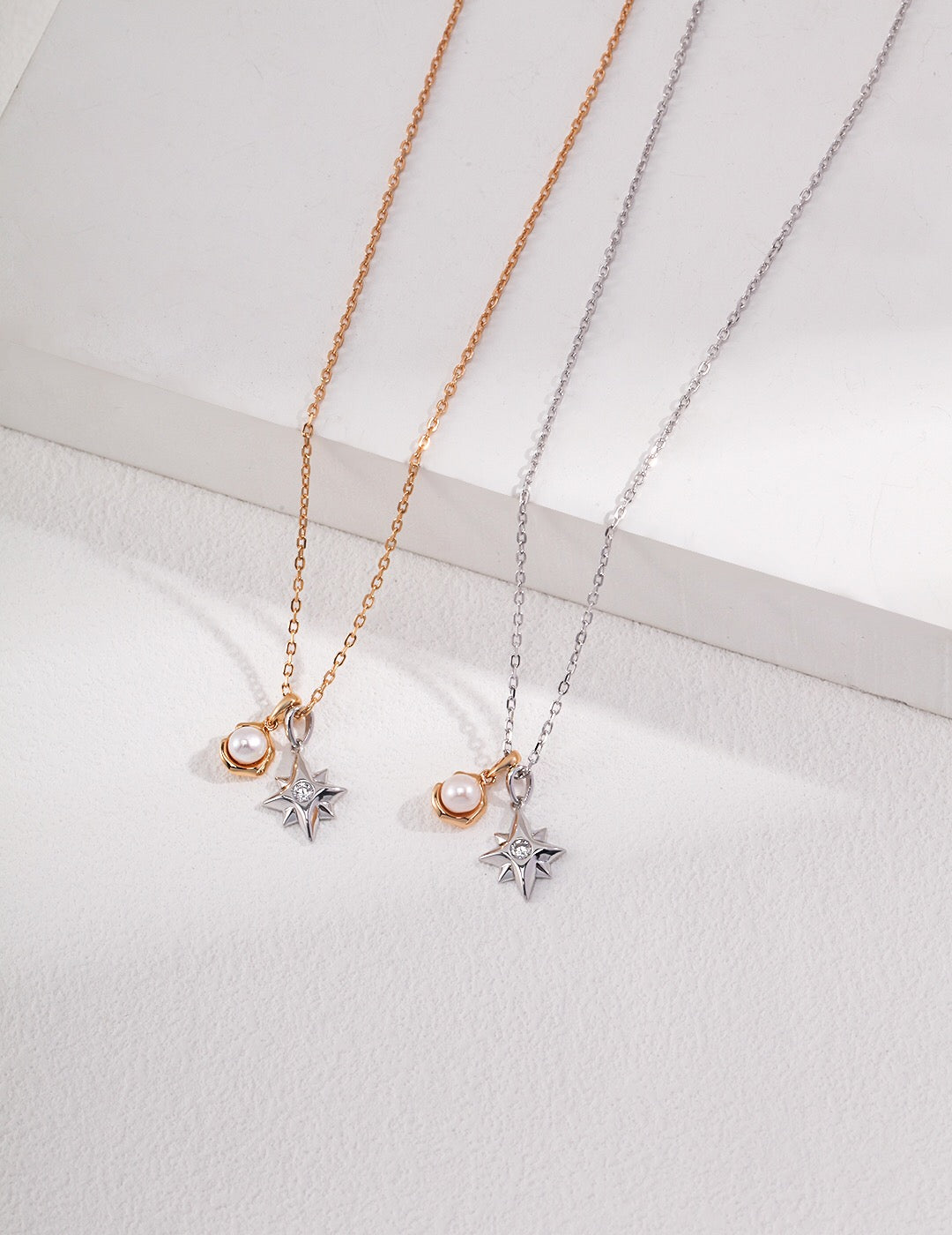 A delicate Dainty Star and Moon Pearl Necklace featuring natural pearls and gold vermeil, showcasing a celestial design.