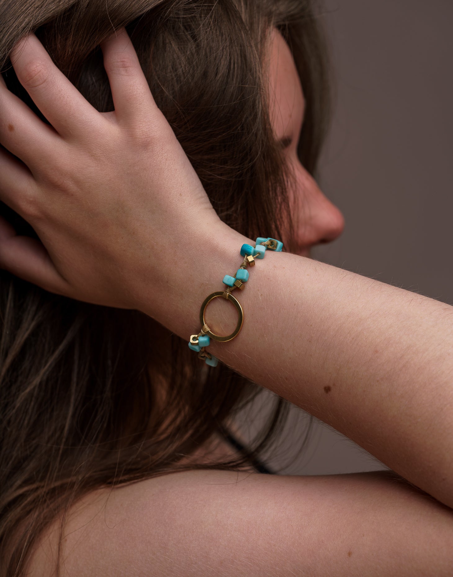 A delicate Dainty Tagua Bracelet featuring mini tagua squares and brass details, elegantly displayed on a soft background.