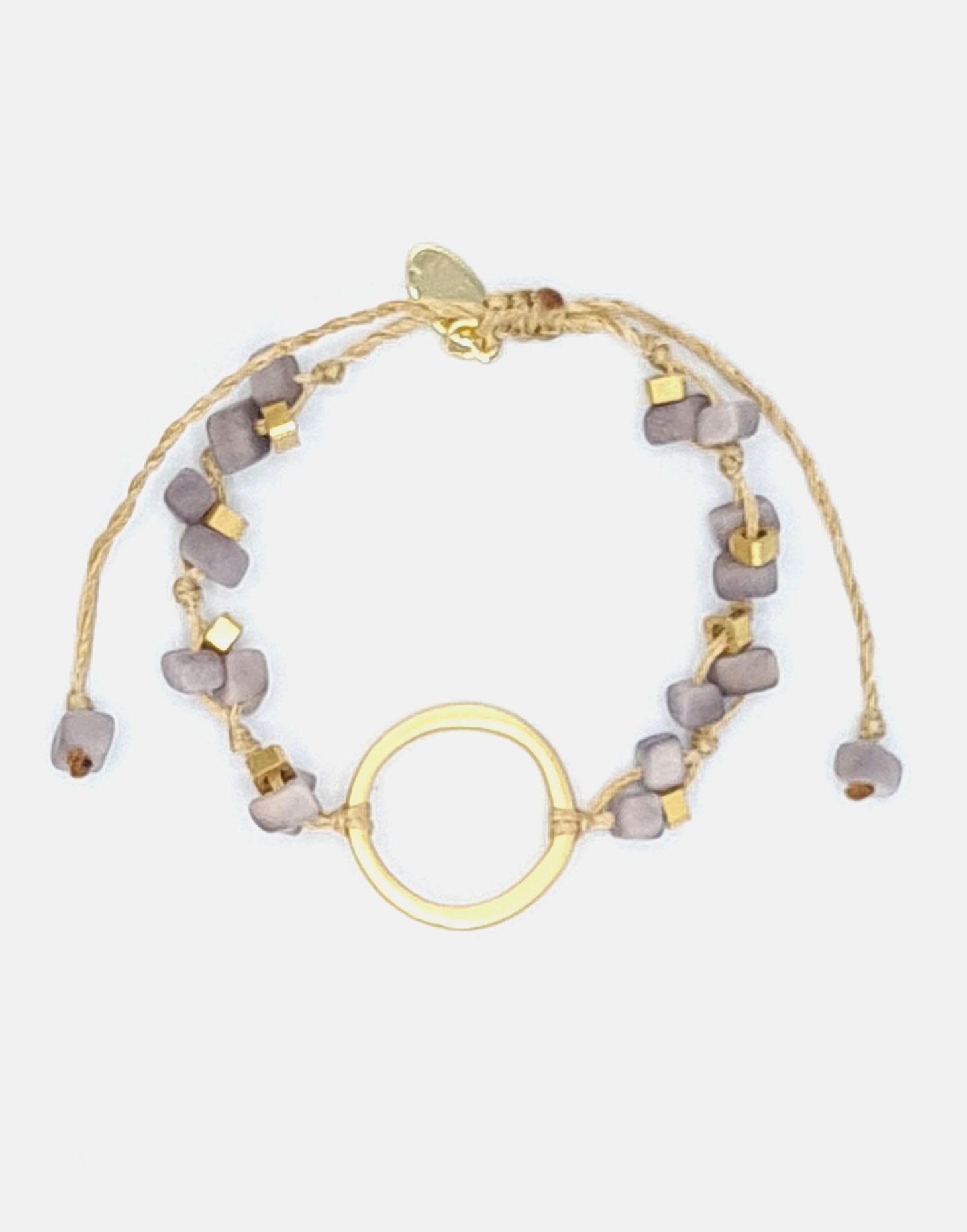 A delicate Dainty Tagua Bracelet featuring mini tagua squares and brass details, elegantly displayed on a soft background.