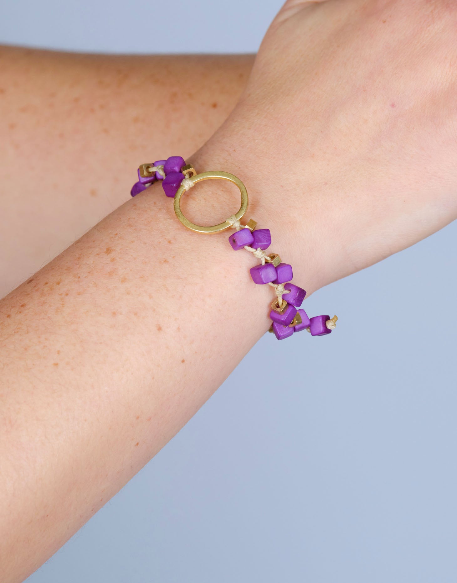 A delicate Dainty Tagua Bracelet featuring mini tagua squares and brass details, elegantly displayed on a soft background.