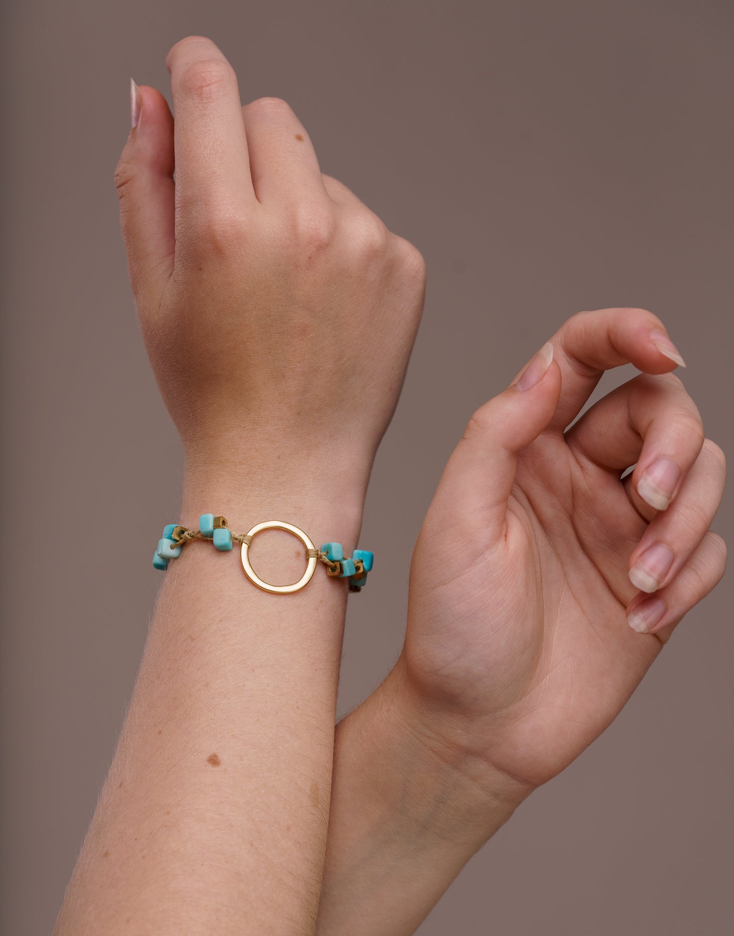 A delicate Dainty Tagua Bracelet featuring mini tagua squares and brass details, elegantly displayed on a soft background.