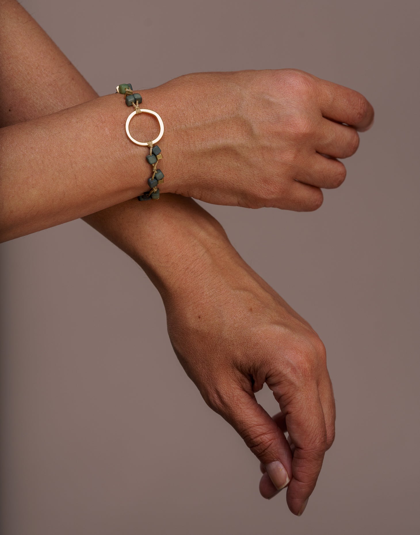 A delicate Dainty Tagua Bracelet featuring mini tagua squares and brass details, elegantly displayed on a soft background.