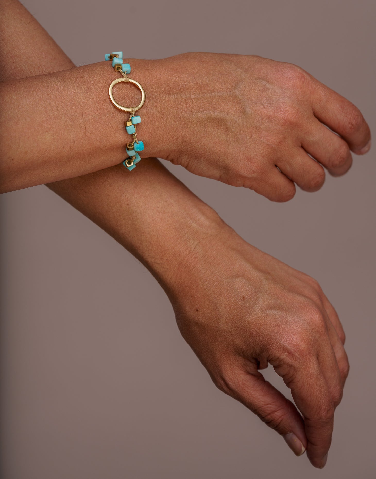 A delicate Dainty Tagua Bracelet featuring mini tagua squares and brass details, elegantly displayed on a soft background.