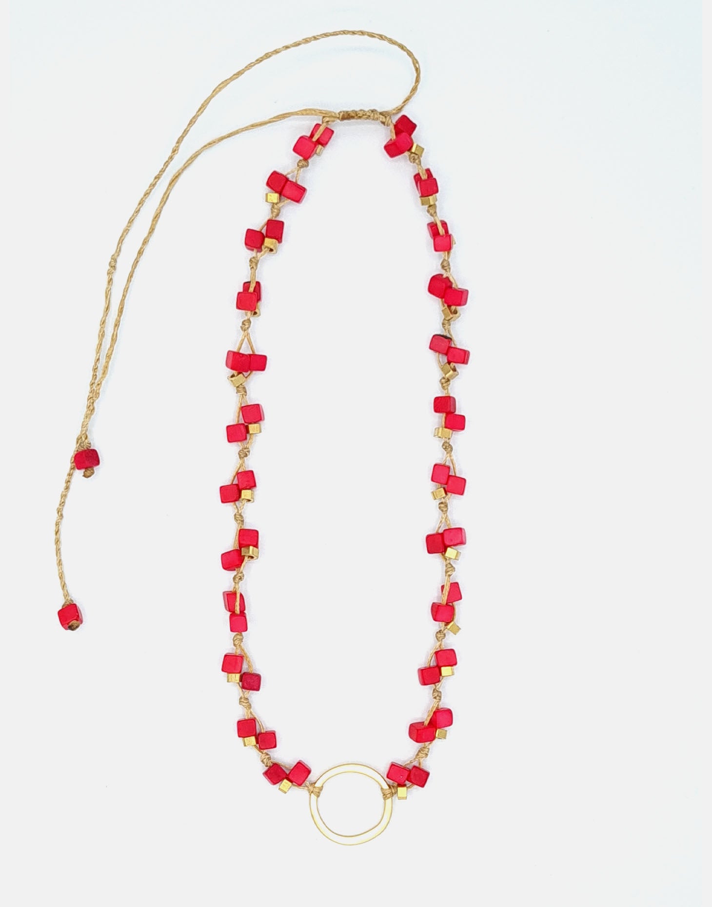 Dainty Tagua Necklace featuring delicate mini tagua squares and brass details, elegantly displayed.