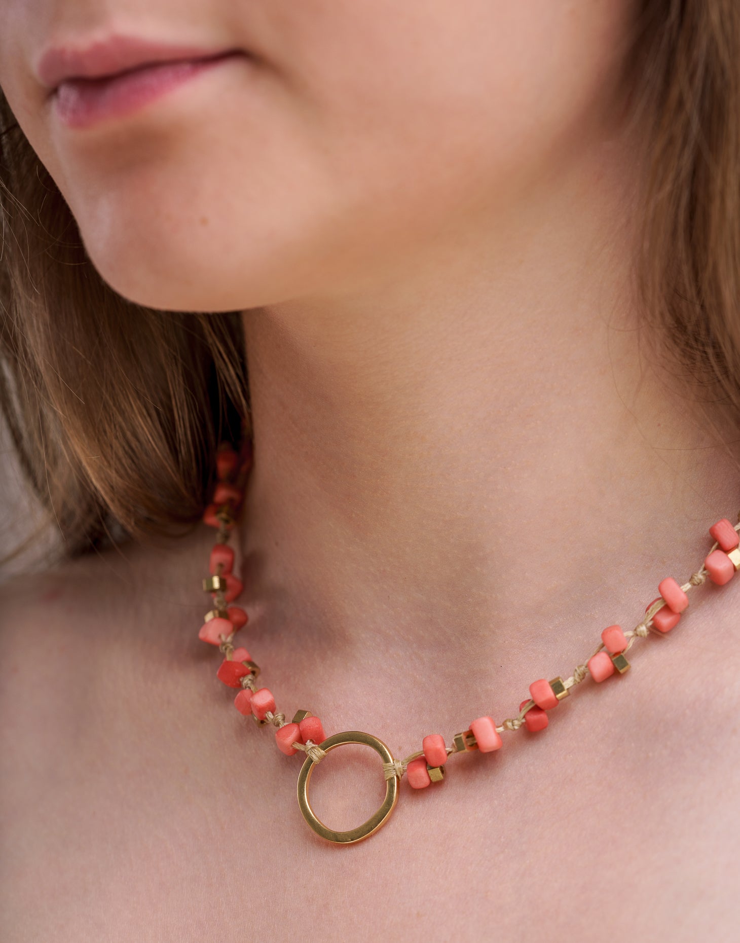 Dainty Tagua Necklace featuring delicate mini tagua squares and brass details, elegantly displayed.