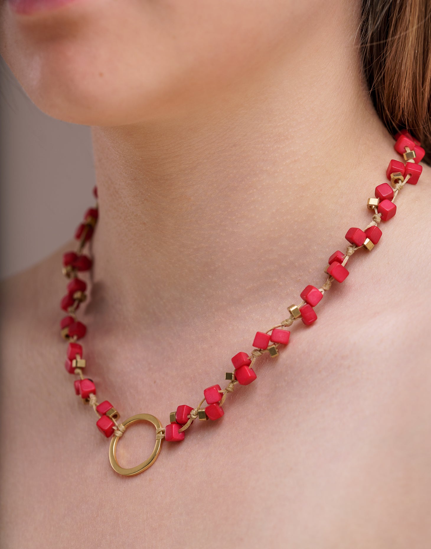 Dainty Tagua Necklace featuring delicate mini tagua squares and brass details, elegantly displayed.