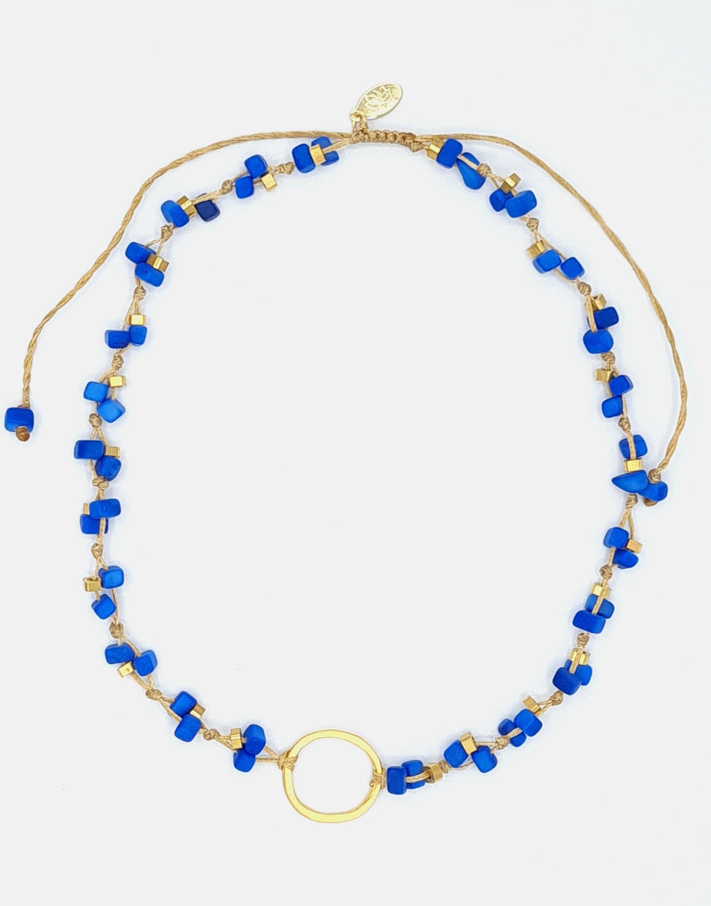 Dainty Tagua Necklace featuring delicate mini tagua squares and brass details, elegantly displayed.