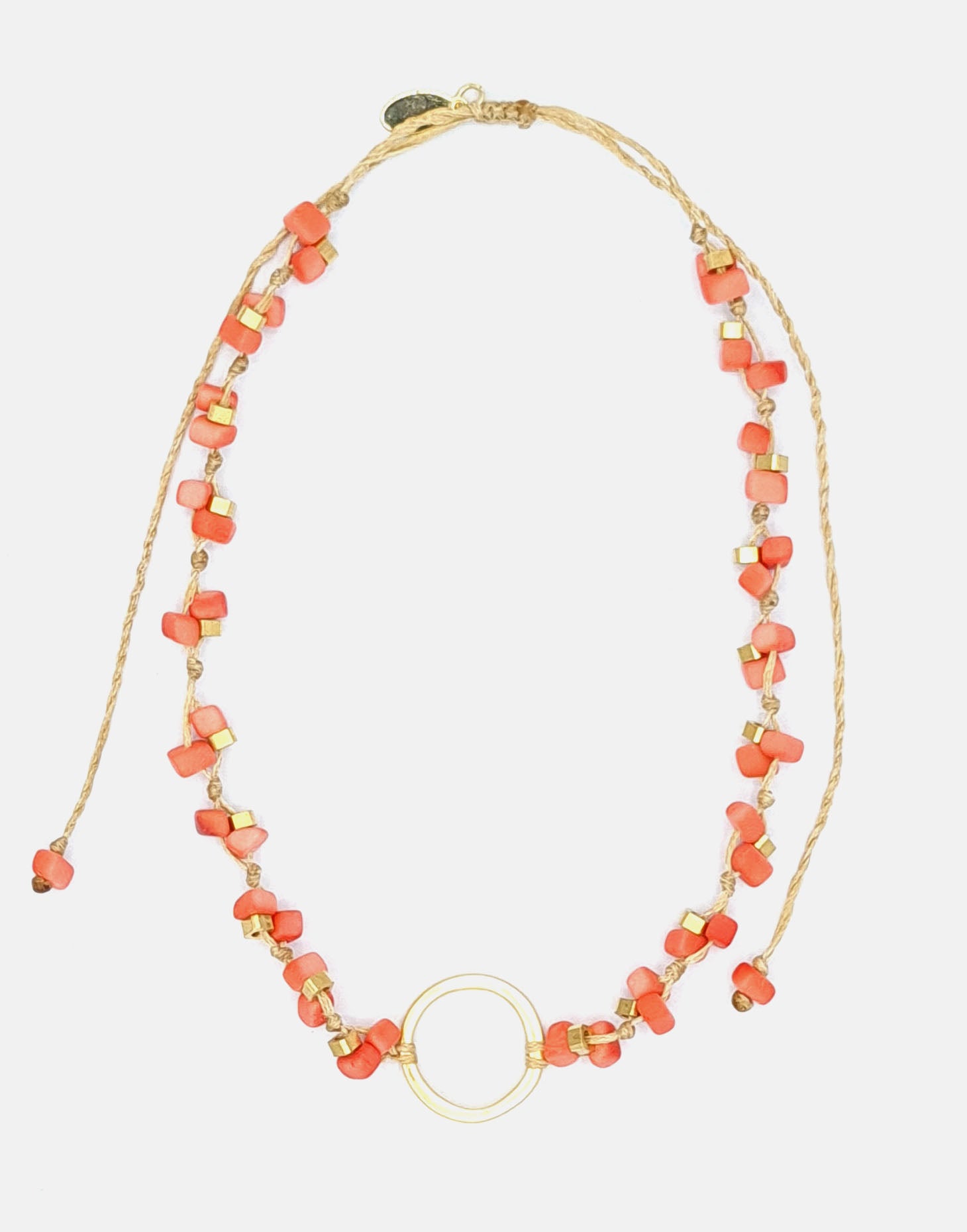 Dainty Tagua Necklace featuring delicate mini tagua squares and brass details, elegantly displayed.