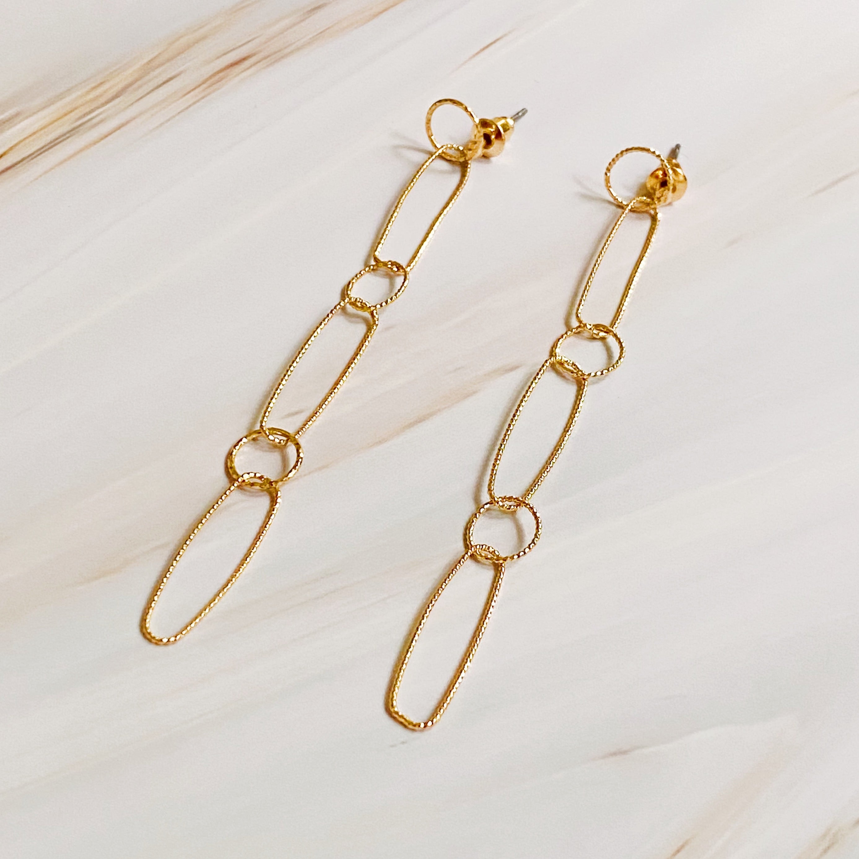 Gold-plated Dangle Dainty Chain Earrings with textured links, showcasing a stylish drop design.