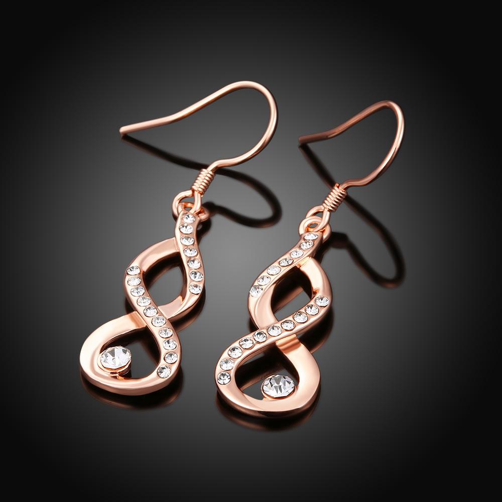 Dangling Infinity Earrings featuring certified crystals and 18K rose gold plating, elegantly designed for comfort and style.