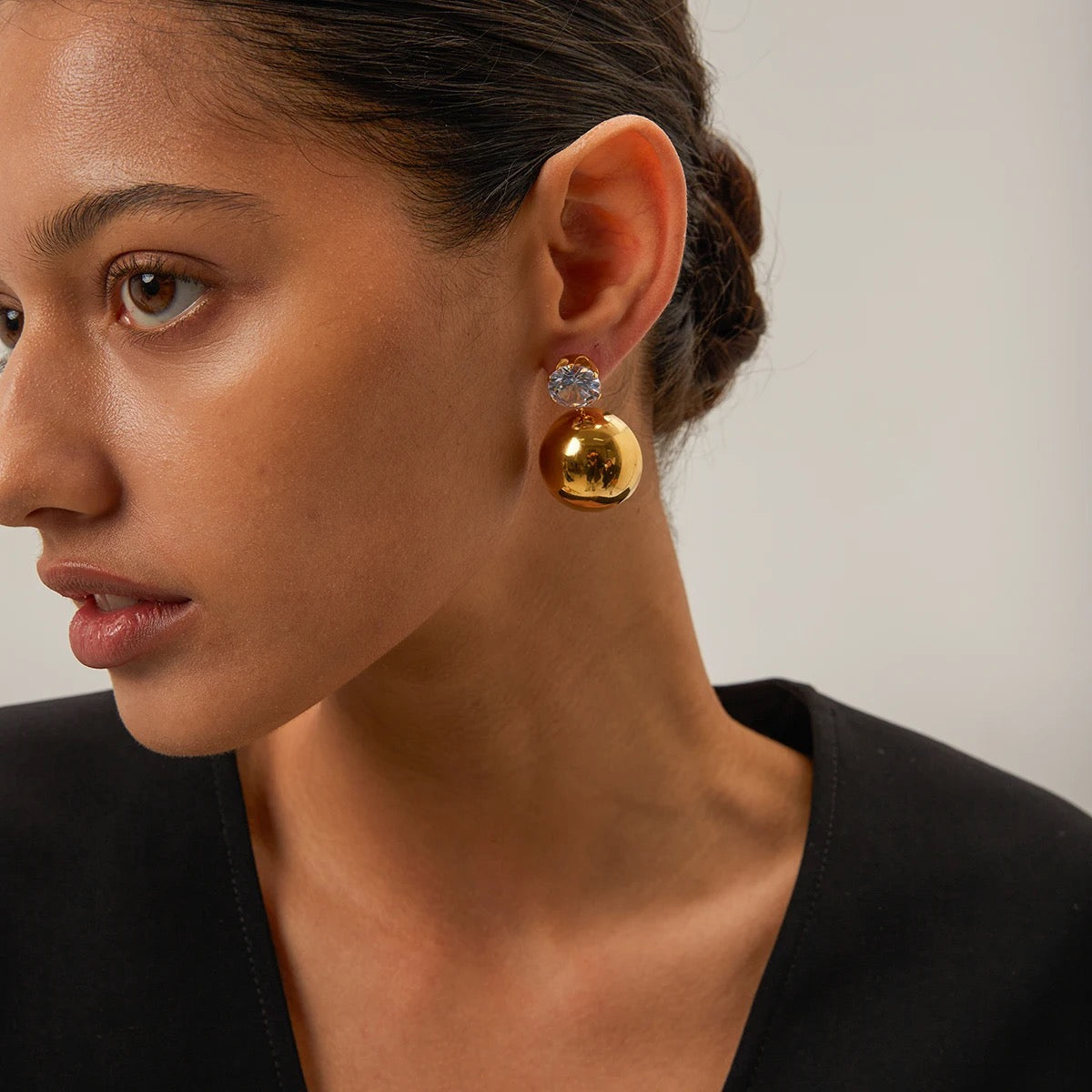 Elegant Day And Night Dangle Earrings in 18k gold plated stainless steel, showcasing their versatile design.