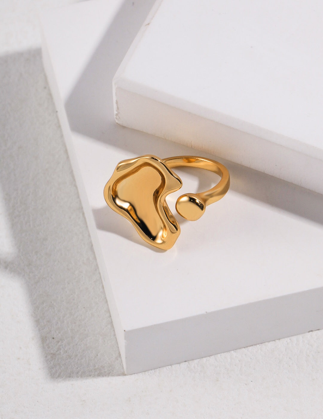 Delicate Mirror Lake Concave Open Ring in sterling silver and gold vermeil, showcasing its unique concave design and adjustable size.