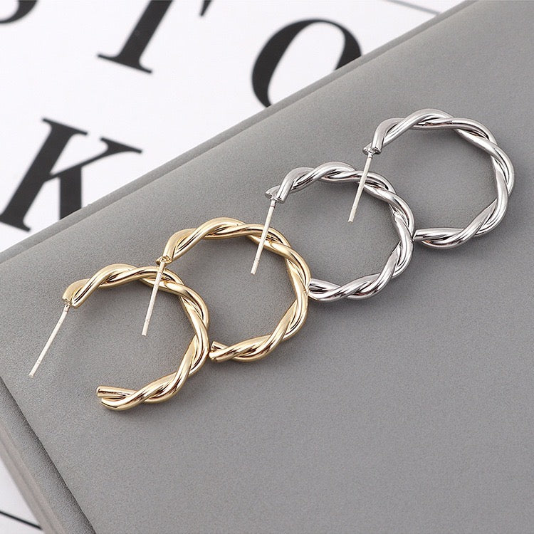 Delicate Twisted C-Shape Earrings made of alloy, showcasing a modern and elegant design.