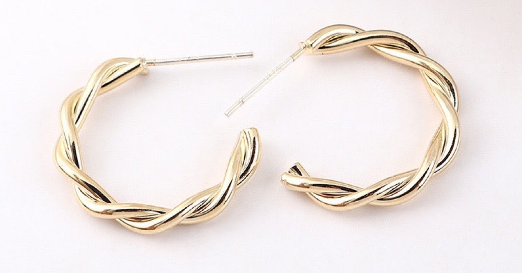 Delicate Twisted C-Shape Earrings made of alloy, showcasing a modern and elegant design.