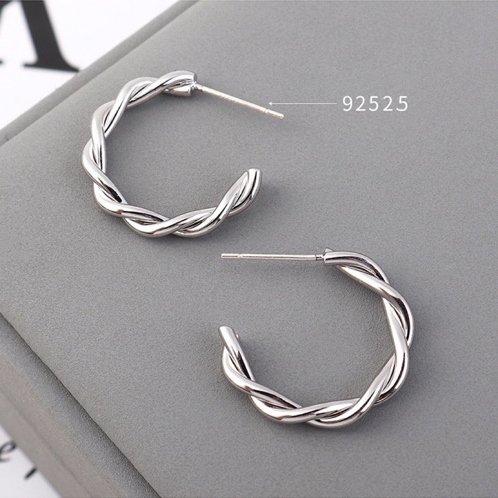 Delicate Twisted C-Shape Earrings made of alloy, showcasing a modern and elegant design.