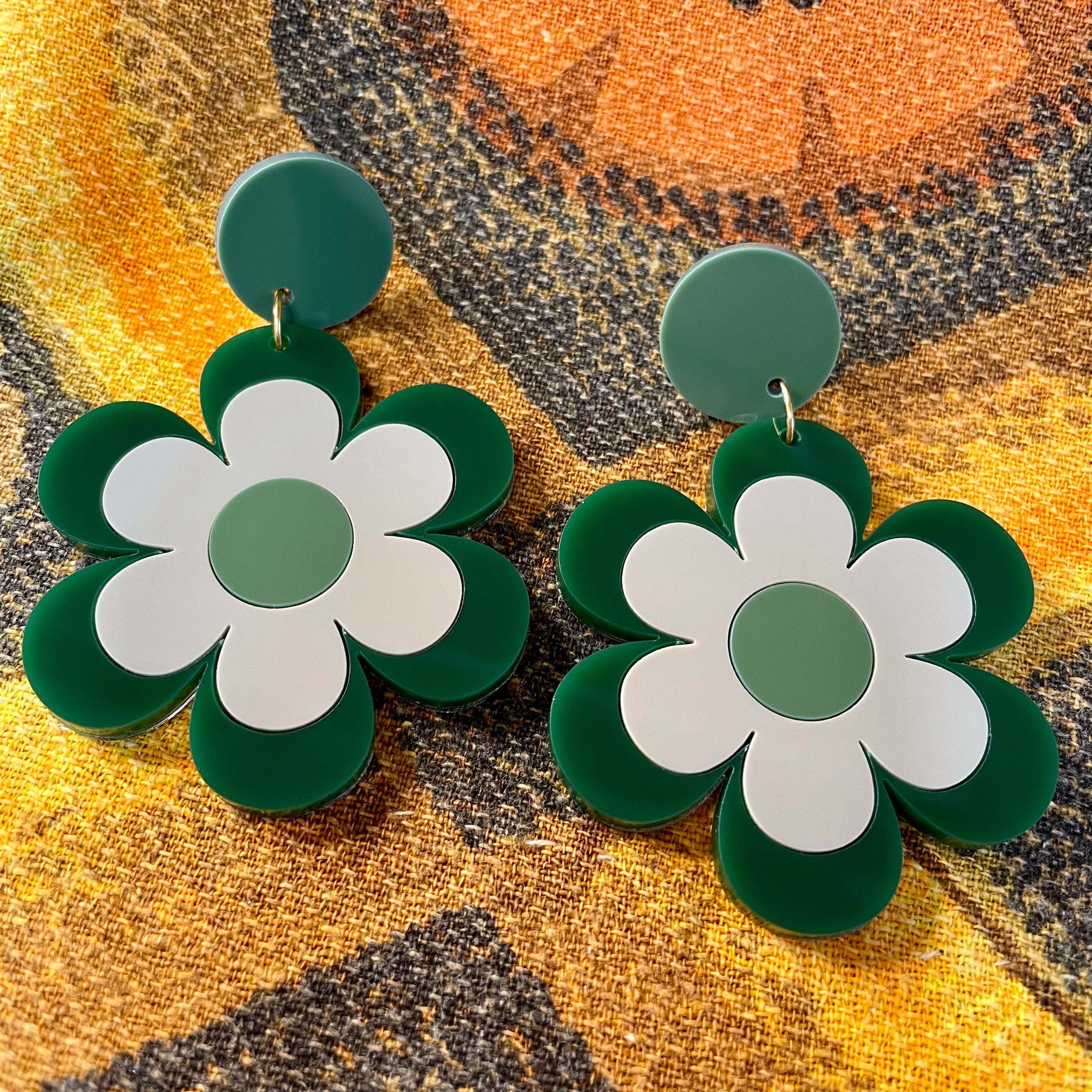 Delilah Daisy Earrings and Brooches featuring vibrant colors and retro design, made from laser-cut acrylic.