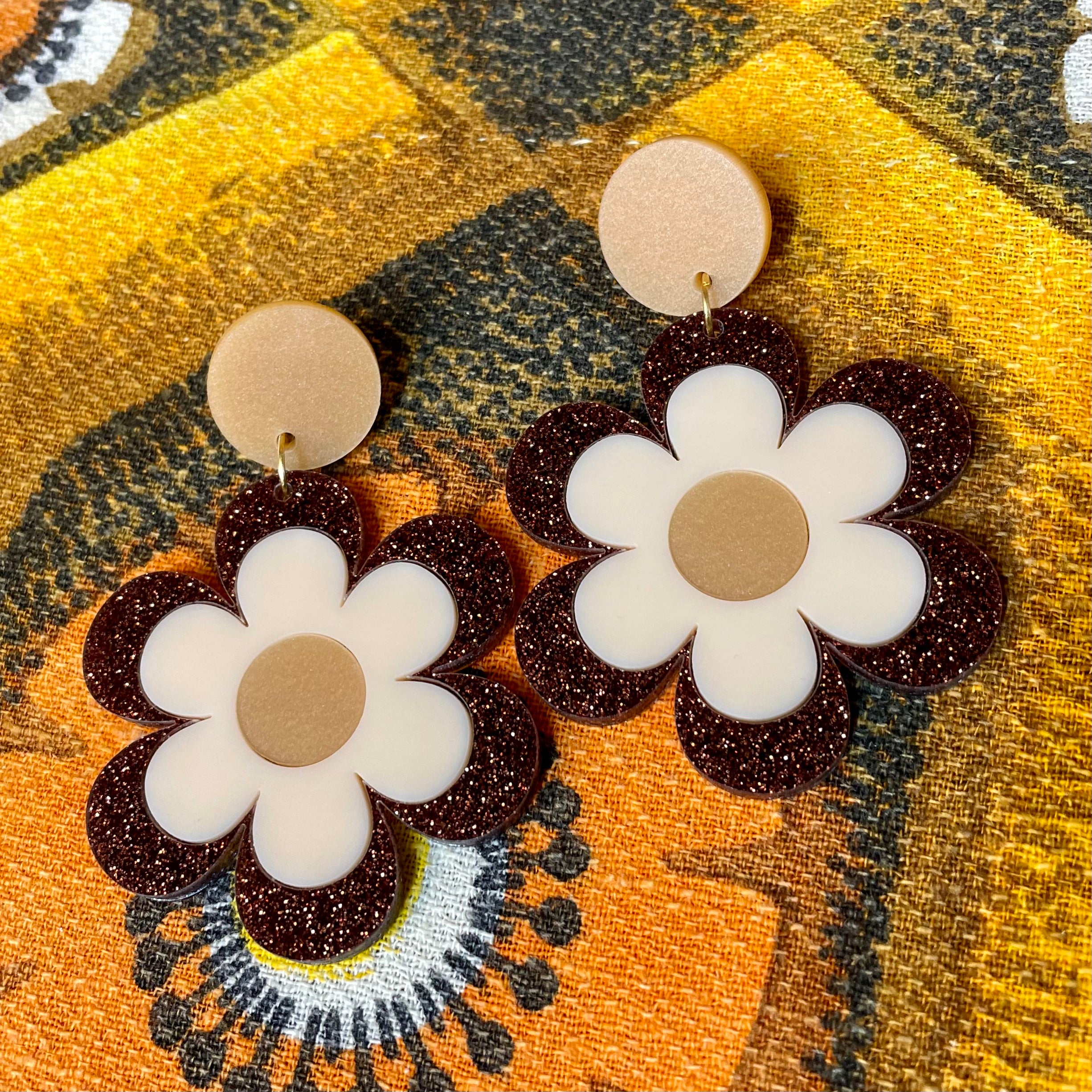 Delilah Daisy Earrings and Brooches featuring vibrant colors and retro design, made from laser-cut acrylic.