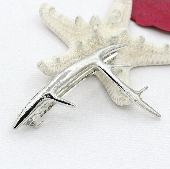 A pair of stylish deer hair clips made from durable alloy, featuring an elegant design suitable for various hairstyles.