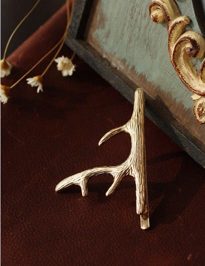 A pair of stylish deer hair clips made from durable alloy, featuring an elegant design suitable for various hairstyles.